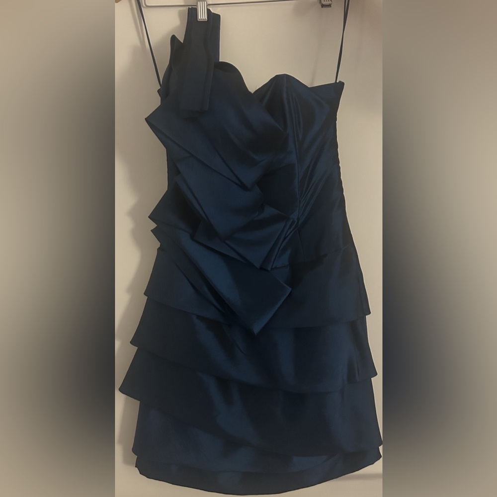 A stunning form fitting dress with an elegant neckline + sultry bold silhouette - Picture 11 of 14